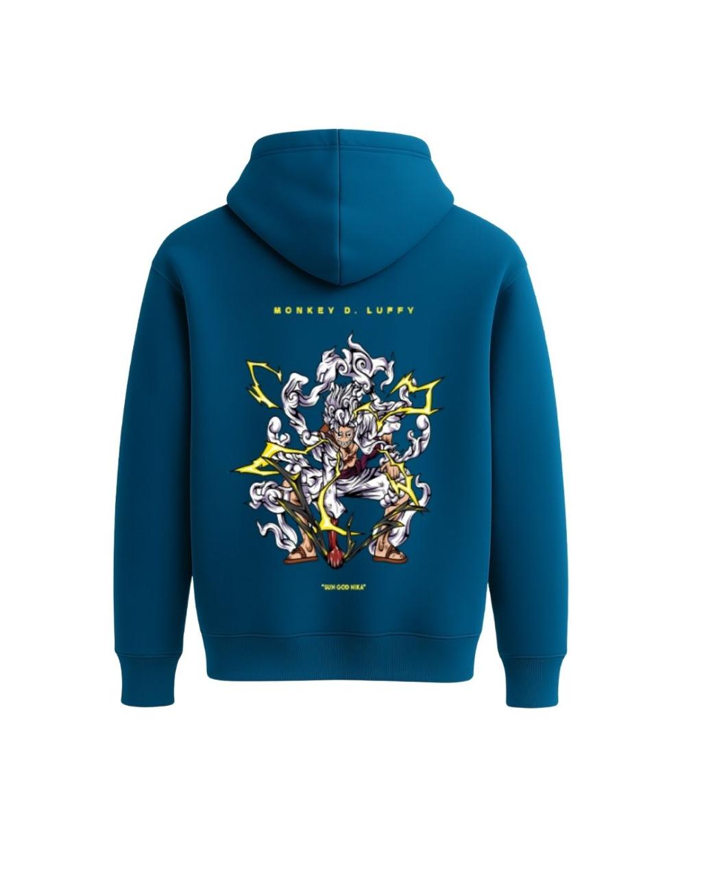 Aura Hoodie Teal Blue – Model Seated Posing in Cozy Casual Outfit